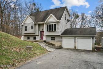 Move right into a roomy contemporary in the woods