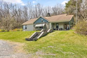Walk to historic Milford from this home on seven acres