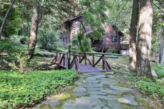 This custom log home is surrounded by nature