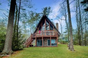 Lakefront home features private dock and custom furnishing