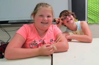 The campers enjoyed making catapults. They even got to compete against each other with aluminum foil balls.