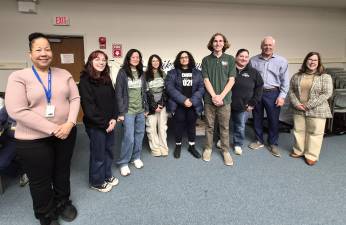 From left: Pike County Commissioner Christa Caceres, Gopher Gold team members Ruby Bailor, Ella Dong, Daisy Olivo Heller, Andria Prime, and Jackson Hancock, Gopher Gold advisor Bernadine Salak, Pike County Commissioner Ron Schmalzle, and Wayne County Commissioner Jocelyn Cramer.