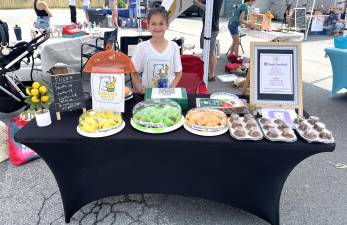 A young entrepreneur at the 2025 fair.