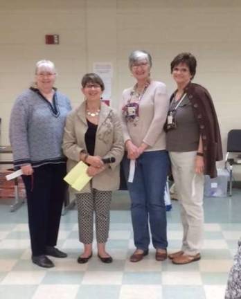 From left, Nancy Halleran, vice president; Cheryl O’Sullivan, president; Marie Sandauer, secretary; and Roseanne Mein, treasurer, of the Milford Valley Quilt Guild.