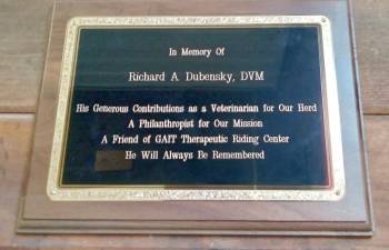 GAIT commemorates veterinarian Richard Dubensky with barn door plaque