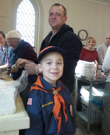 Aaron Gutschmidt and his son, Cub Scout Jacob Gutschmidt, volunteered.