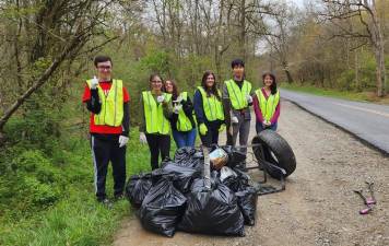 The Pennsylvania Department of Transportation and Keep Pennsylvania Beautiful are inviting 10th -12th grade students from around the state to help keep Pennsylvania clean and beautiful through the Young Ambassadors of Pennsylvania program. Pictured here are some of the Young Ambassadors at work. Provided photo.