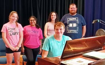Braedon Ross (at piano) rehearses with some cast members. The young prodigy is back as musical director of the Presby Players Community Theater production of Celtic Cabaret. Provided photo.