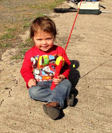 Clearly the youngest fisher-kids, 2 year-old Tristin Rogers may not have had fishing on his mind, but he was still there trying.