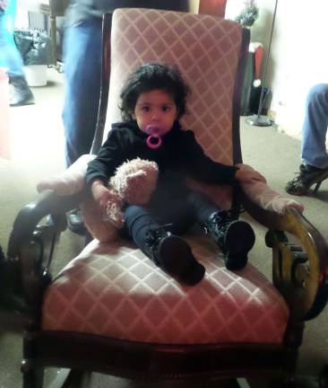 Madison Cabral rocked with a stuffed friend as the classic cartoons played (Photo by Frances Ruth Harris)