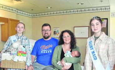<i>From left: Dairy Miss Chloe Tyler, Robert Dodge III, Noreen Vogel (with baby Robert Dodge IV), and Wayne County Dairy Maid Zoey Tyler.</i>