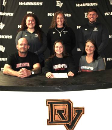 Jordan Dickerson signs her letter of intent to play at Northampton Community College. Front row (L-R): Mike Dickerson, Jordan Dickerson, and Maria Dickerson. Back row (L-R): Assistant coach Marisa Balcarcel, head coach Mikaela Smith, and assistant coach Mark DePolito.
