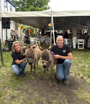 Danielle Lattanzio and Ralph Burger of Swartwood Farm with Mia (left) and Lucy.