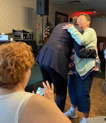Patrick Dunn dances with Linda Schultz, former owner of Len and Joe's.
