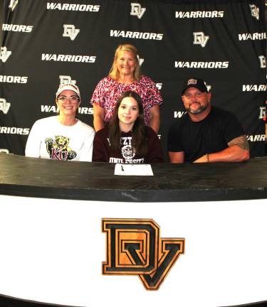McKenzie Montgomery signs her letter of intent to continue her acro and tumbling career at Kutztown University. Front row (L-R): Jessica Montgomery, McKenzie Montgomery, and Ken Montgomery. Back row: Head coach Jen Marchetti.