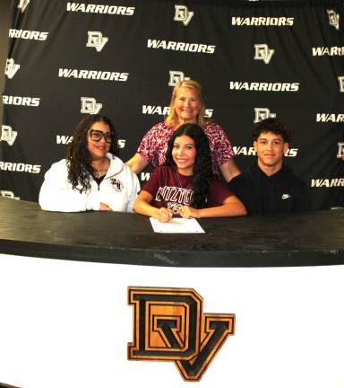 Vicely Cepeda will continue her acro and tumbling career at Kutztown University. Front row (L-R): Vili Cepeda, Vicely Cepeda, and brother Zion Colon. Back row: Head coach Jen Marchetti