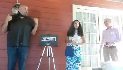 From left: Lt. Gov. John Fetterman; his wife, Gisele Barreto Fetterman; and Milford Mayor Sean Strub (Photo by Frances Ruth Harris)