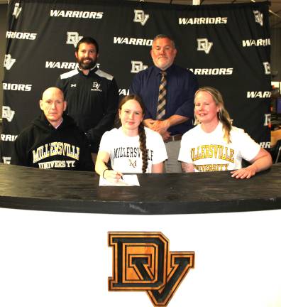 Emma Simmons commits to continue her track and field career at Millersville University. Front row (L-R): Michael Simmons, Emma Simmons, and Heather Simmons. Back row (L-R): Assistant coach Declan Carroll and head coach Nick Quaglia.