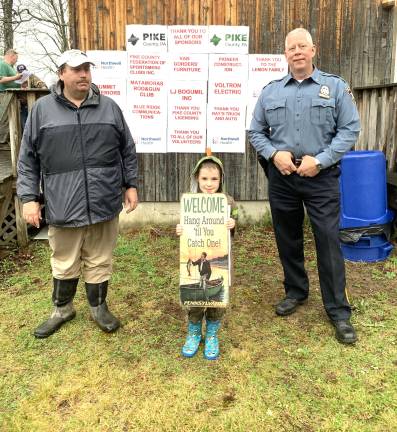 James Leiser, volunteer; Jason Montana, grand prize winner; and Pike County Sheriff Brian M. Vennie encourage kids to enter this year’s Fishing Derby.