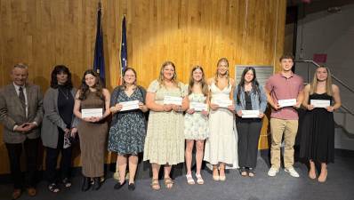 Paul Brislin of the Pike Chamber (left) and Regina Thoenig for the Amanda Nicole Thoenig Memorial Scholarship Fund with some of the 2025 Greater Pike Community Foundation scholarship recipients.