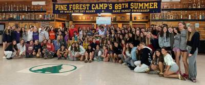 Barbara Black and Pike County Commissioner Ronald Schmalzle, along with Pine Forest campers, present a $1,500 check to founder Rosemary Martynuk of the Wallenpaupack Area High School Kids Food Pantry