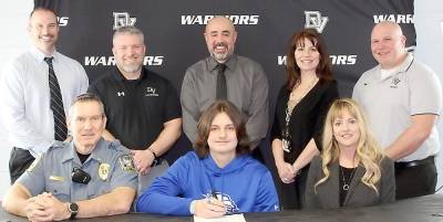 Pictured in front: Delaware Valley High School senior Connor Gaughan is flanked by his father, Marty Gaughan on the right, and his mother, Kelly Gaughan, on his left; and standing in back, from left to right: Superintendent Dr. Brian Blaum, assistant coach Jesse Jayne, assistant coach Dan Gonzalez, guidance counselor Molly Blaut and head coach Jeff Krasulski. Photo provided by Leslie Lordi/Delaware Valley High School.