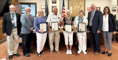 At the July 19th Commissioners Meeting, Board of Elections Director Nadeen Manzoni and Elections Chief Registrar Char Scheuermann welcomed eight individuals into the Voter Hall of Fame. To be inducted, a voter must have voted in a minimum of 50 consecutive elections. Picttured are Commissioners Tony Waldron and Matthew Osterberg; Voter Hall of Fame Inductees Betty Reaggs, Robert Nied, Sandra Smith, Ella Eggenberger; Commissioner Ron Schmalzle; and Elections Director Nadeen Manzoni. Photo provided by the Pike County Board of Elections.