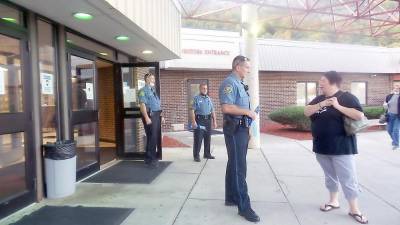 School police officers passed out masks at DV’s last school board meeting and barred entry to those who refused to wear them. (Photo by Frances Ruth Harris)