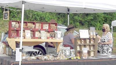 A scene from last year's farmers market in Vernon, which starts up again this Saturday (Photo by Janet Redyke)