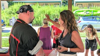 Lenape Chief Adam DePaul speaks with State Rep. Tarah Probst.
