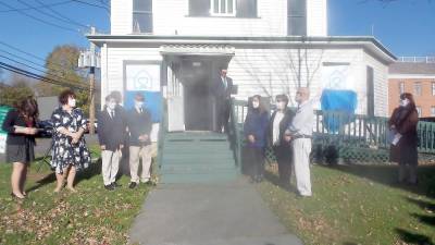 District Attorney Ray Tonkin with members of his staff in front of the newly dedicated Dickson House (Photo by Frances Ruth Harris)