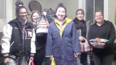 Members of the Girl Scouts in the Heart of Pennsylvania (GSHPA) Troop 52735 were on hand to pack care packages for the homeless. Volunteers carried them in their cars to distribute to any homeless person they found. They also had sleeping bags for anyone they found outside who did not want to come inside. From left are Ciara Valerio, Meghan Delaney, Zoe, and Laura and Doreen Delaney.