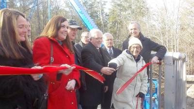 The ribbon is cut at the newly refurbished Mott Street Bridge