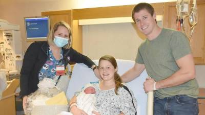 Pictured are Harmony Beattie, RN, Kayla Schariest with Carter, and Steven Schariest (Photo provided)