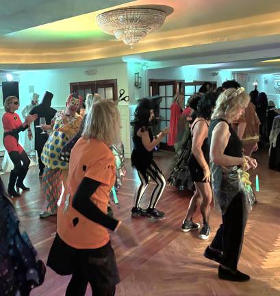 Dance floor fun at the Oct. 30 <b>Milford Masquerade MEC Halloween party.</b>