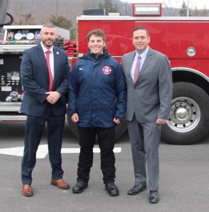 Orange County Commissioner of Emergency Services Peter J. Cirigliano II, Firefighter 1 graduate Tyler Purta of the Village of Florida, and Orange County Executive Steven M. Neuhaus.