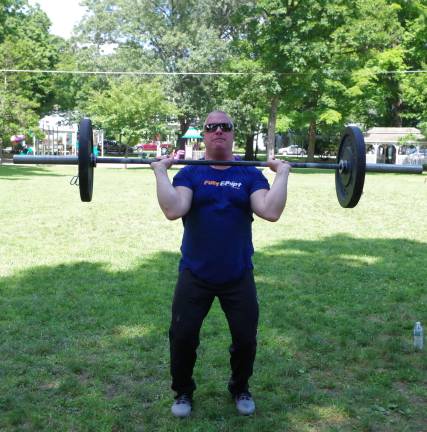 Cross Fit Blue Bridge owner Mike Repecki working out.