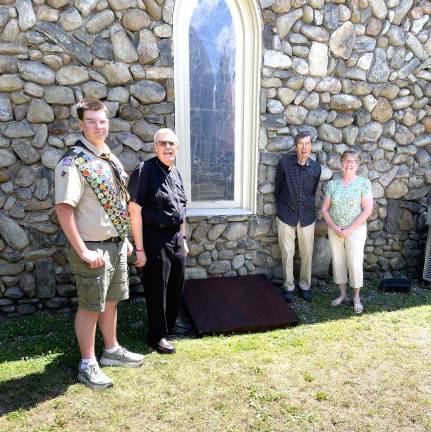 Pictured with Evan in front of his window well cover are Rev. William Stewart, Priest in Charge; Ralph Pinto, Jr. Warden; and Barbara Hartman, Sr. Warden.