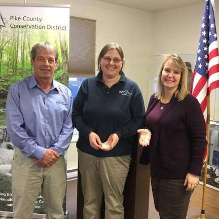 Senior resource conservationist Ellen Enslin and executive director Michele Long pictured with board chair Scott Savini (Photo provided)