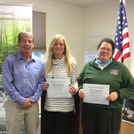 Technical program assistant Kelly Rodemich and resource conservationist Marianna Quartararo are pictured with board chair Scott Savini (Photo provided)