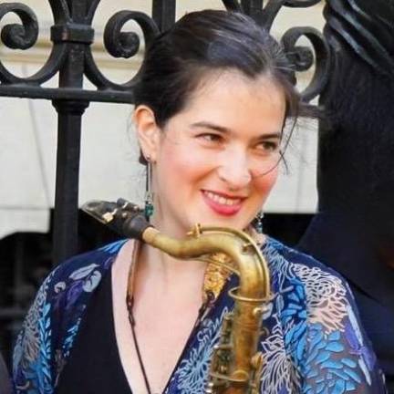 Laura Andrea Leguia on saxophone.