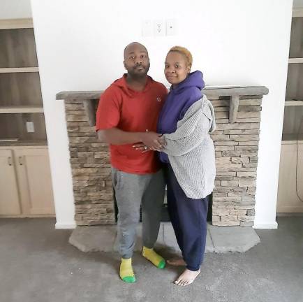 Ray and Naeemah Polhill in their new home. (Photo by Naeemah Polhill)
