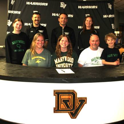 Kimberly Smyser will continue her cross country and track and field career at Marywood University. Front row (L-R): Jennifer Smyser, Kimberly Smyser, Michael Smyser, and brother Owen Smyser. Back row (L-R): Sister Lindsey Smyser, head coach Keith Fitzpatrick, assistant coach Justin Roselli, and track coach Audrey Dennis.