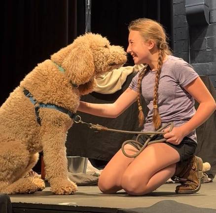 Annie (played by Maelyn (Mae) McCormack) with her stage dog Sandy (Played by local Goldendoodle Bernie)