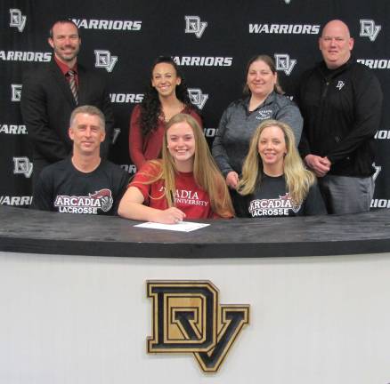Senior lacrosse player Emily Covert signs with Arcadia University