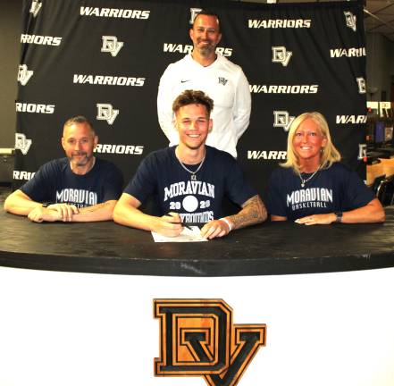 Tyler Lombardo signs his letter of intent to play basketball at Moravian University. Front row (L-R): Thomas Lombardo, Tyler Lombardo, and Cassie Napier. Back row: Head coach Kris Holtzer