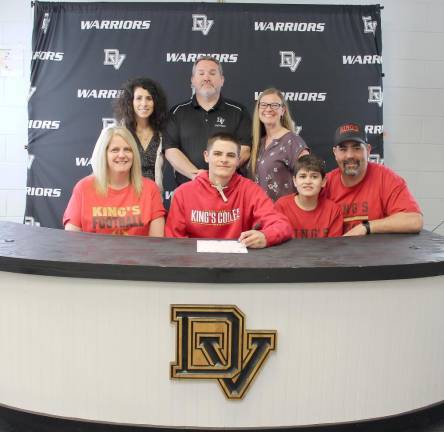 Pictured (left to right: front row) – Danielle Anderson, senior Shane Anderson, brother Aidan Anderson and John Anderson. (back row) – High school principal Dr. Nicole Cosentino, assistant football coach Nick Quaglia and guidance counselor Crystal Ross