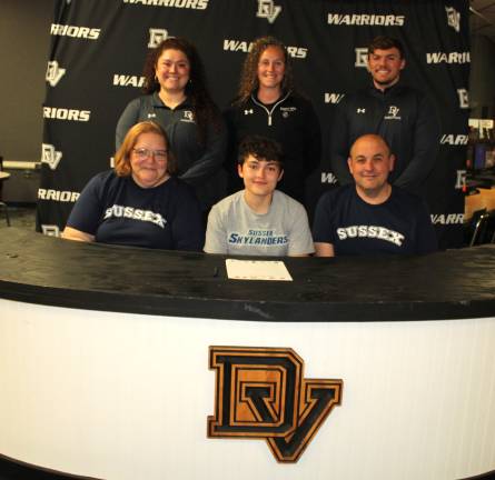 Carmella Ford commits to playing basketball at Sussex County Community College.Front row (L-R): Sarah Pflanz, Carmella Ford, and Mike Pflanz. Back row (L-R): Assistant coach Marisa Balcarcel, head coach Mikaela Smith, and assistant coach Mark DePolito.
