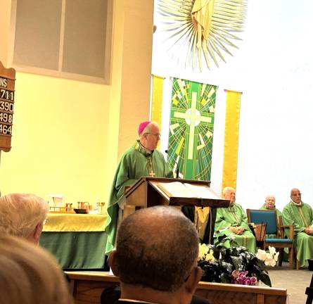 The Most Reverend Joseph C. Bambera, Bishop of Scranton captivates congregants at the 50th anniversary Mass of St. Vinicent de Paul.