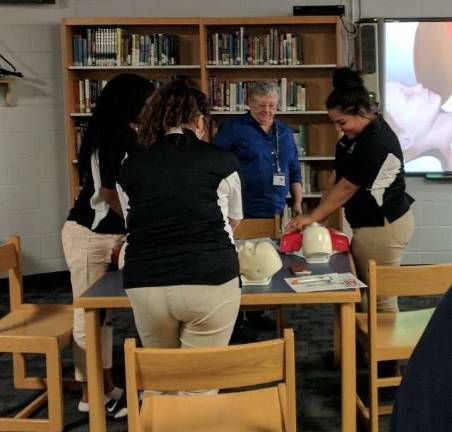 Students Ilia Williams, Emily McElroy, Destiny Mann, and Instructor Carol Saxmon (Photo provided)